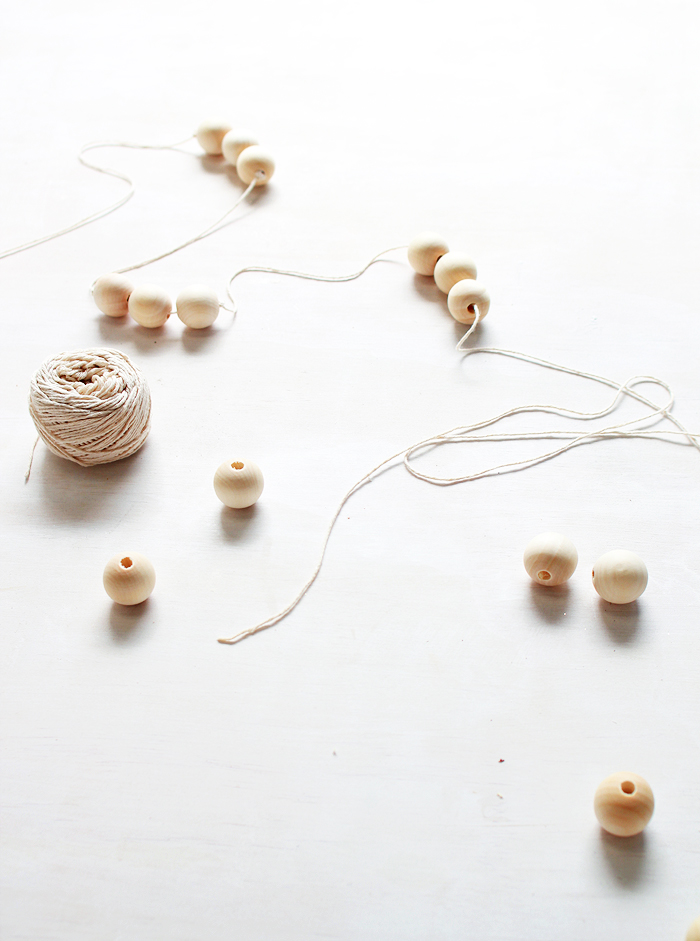 It only takes 5 minutes to make these simple wooden bead garlands! 